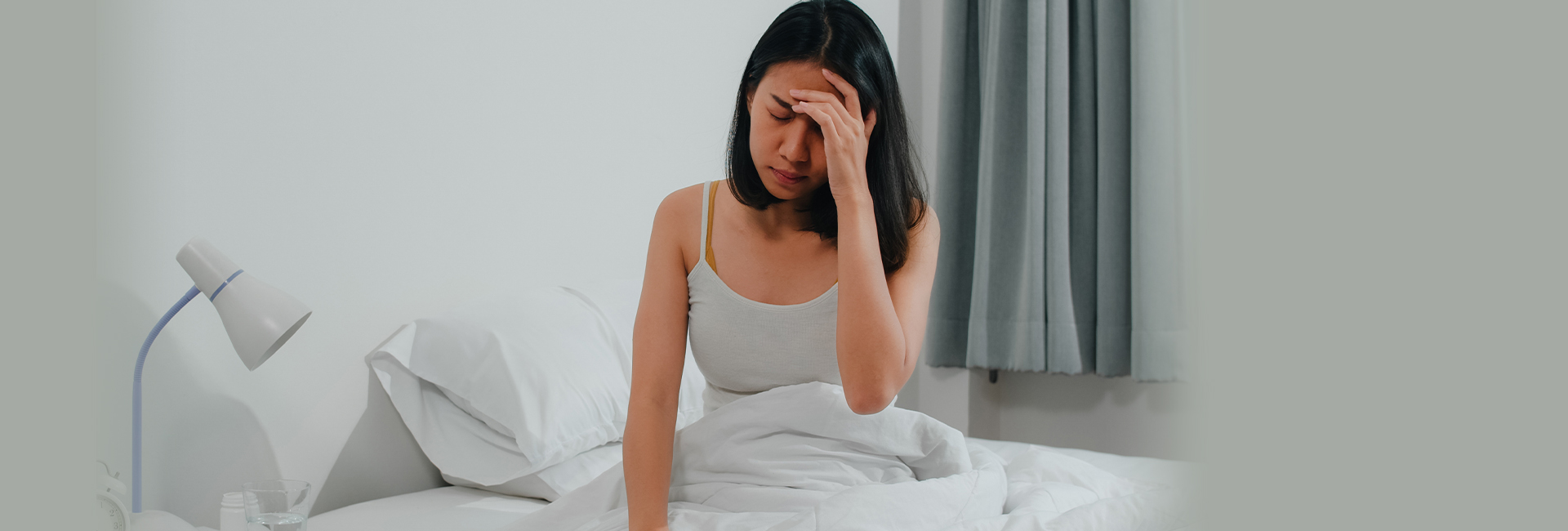 Woman resting with eyes closed, recovering from fatigue and brain fog with functional medicine care in Charlotte, NC